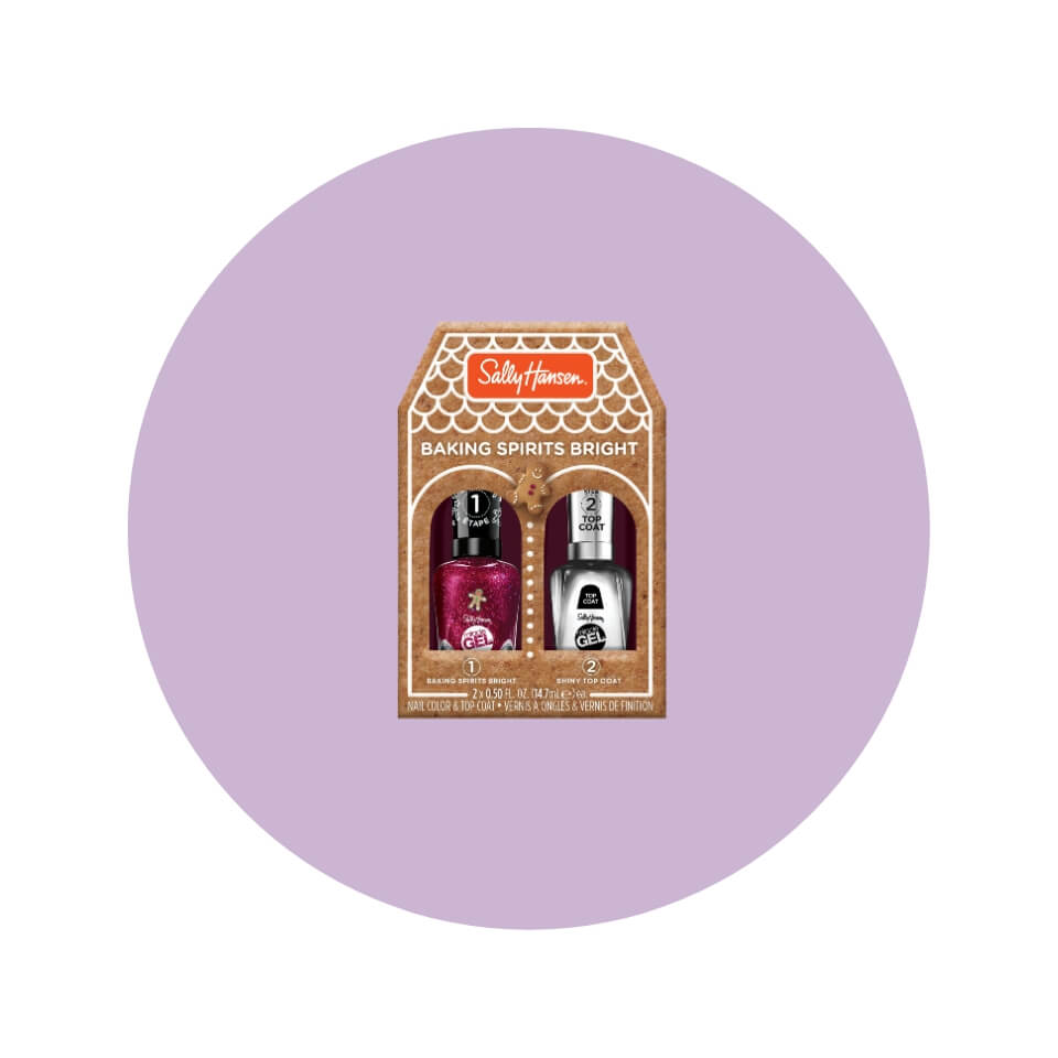 A brown gingerbread-house-shaped box with two nail polishes inside a light purple circle
