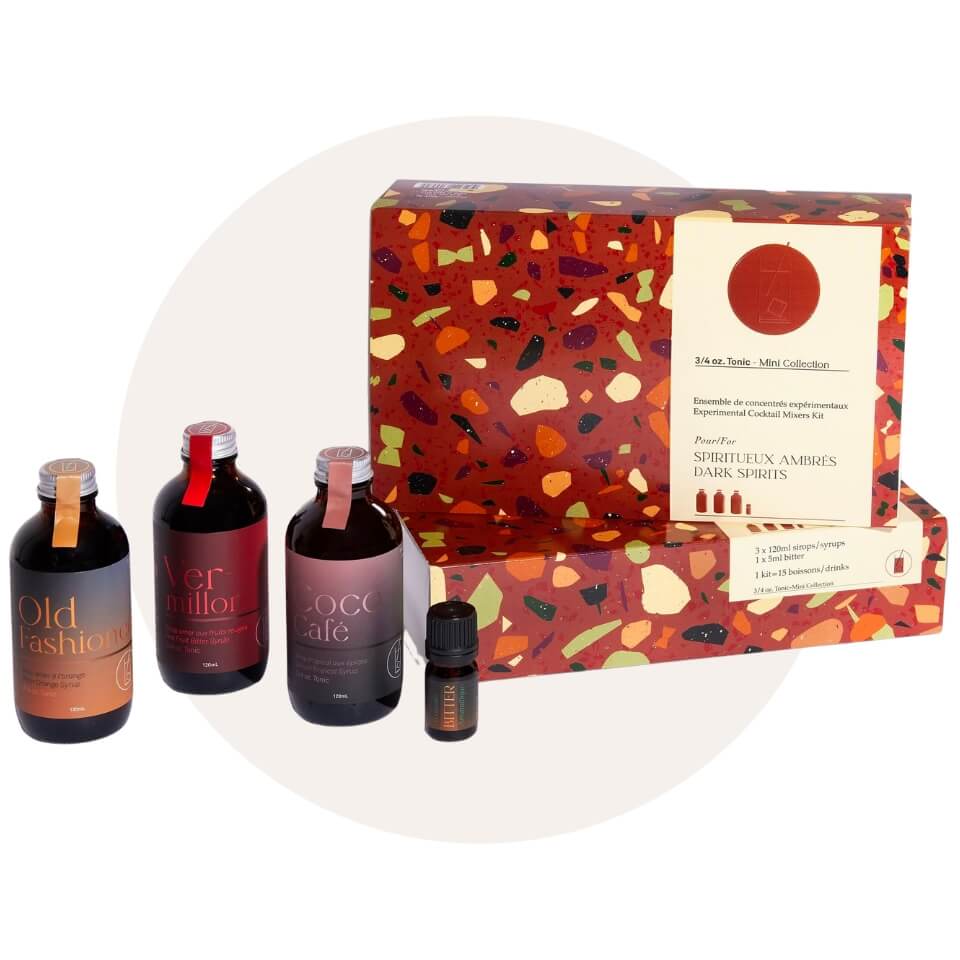 Gift boxes and four bottles with warm, dark labels over a cream-coloured circle