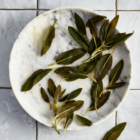 white plate with sage leaves