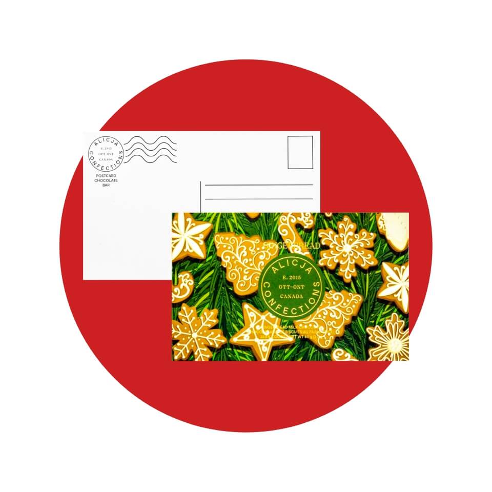 The back view of a postcard and front view of a chocolate bar decorated with gingerbread cookies over a red circle