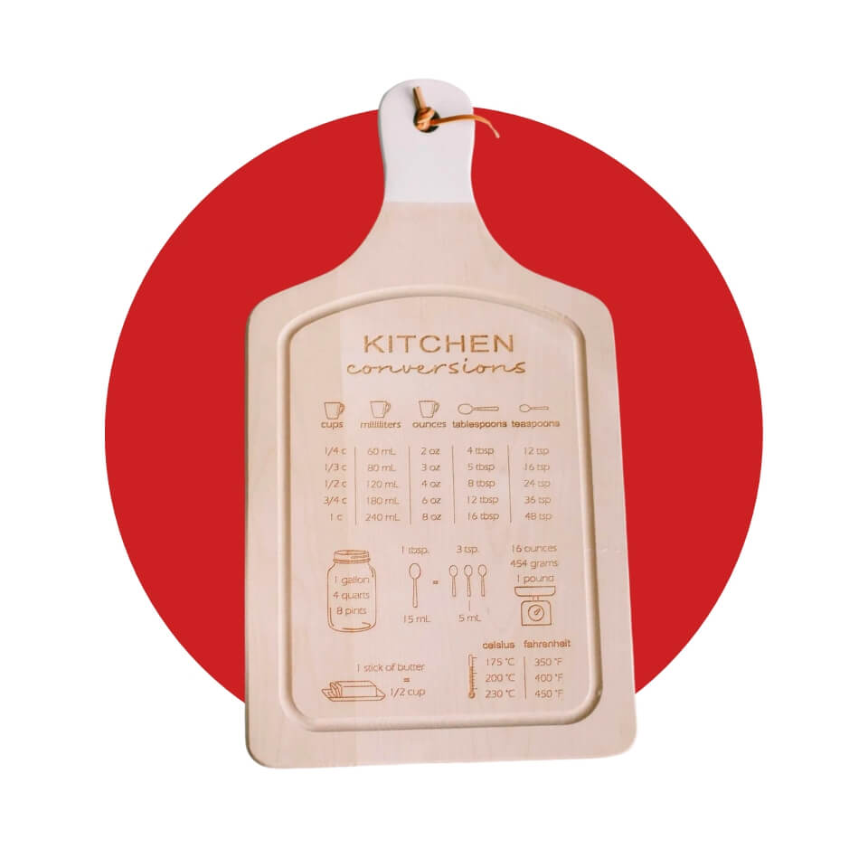 A wooden cutting board with kitchen conversion details over a red circle