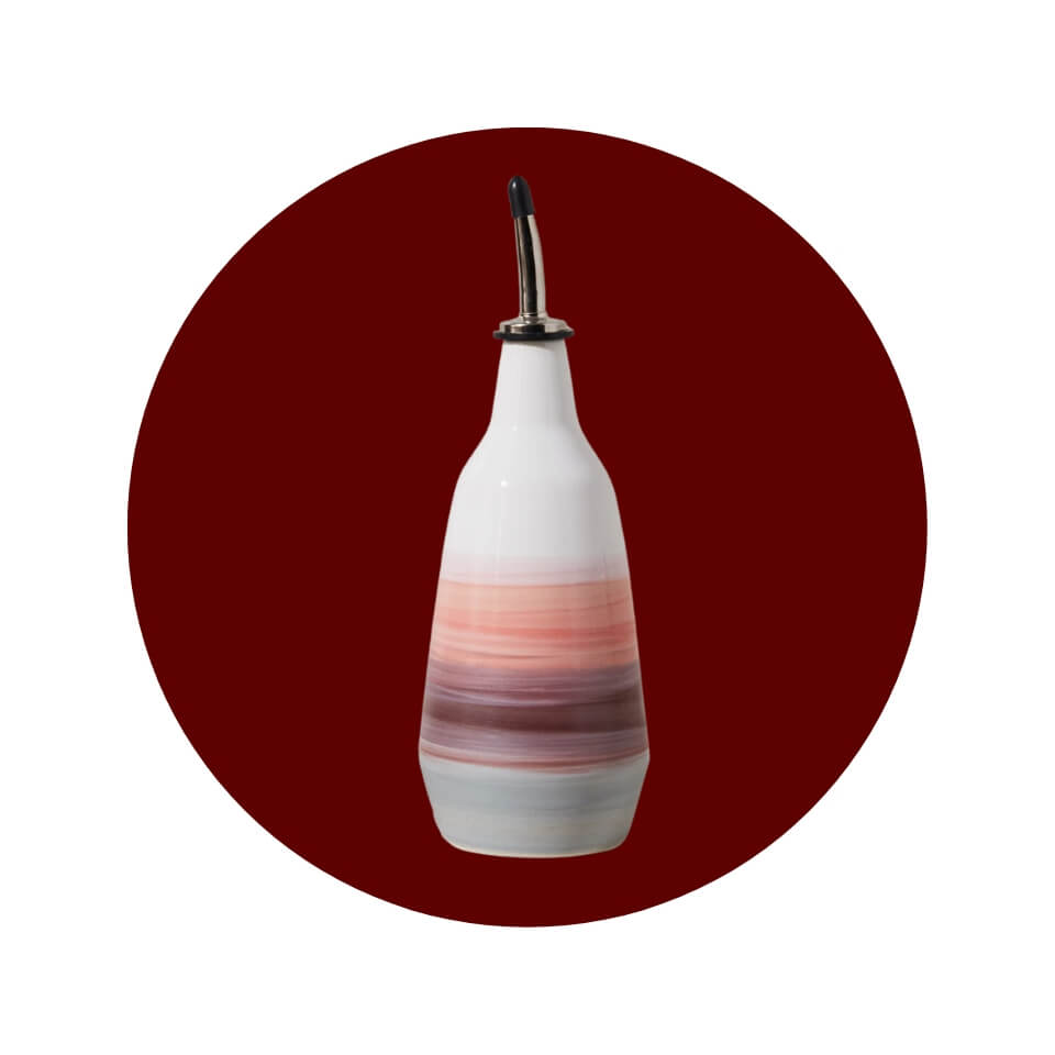 A ceramic oil dispenser in a maroon circle