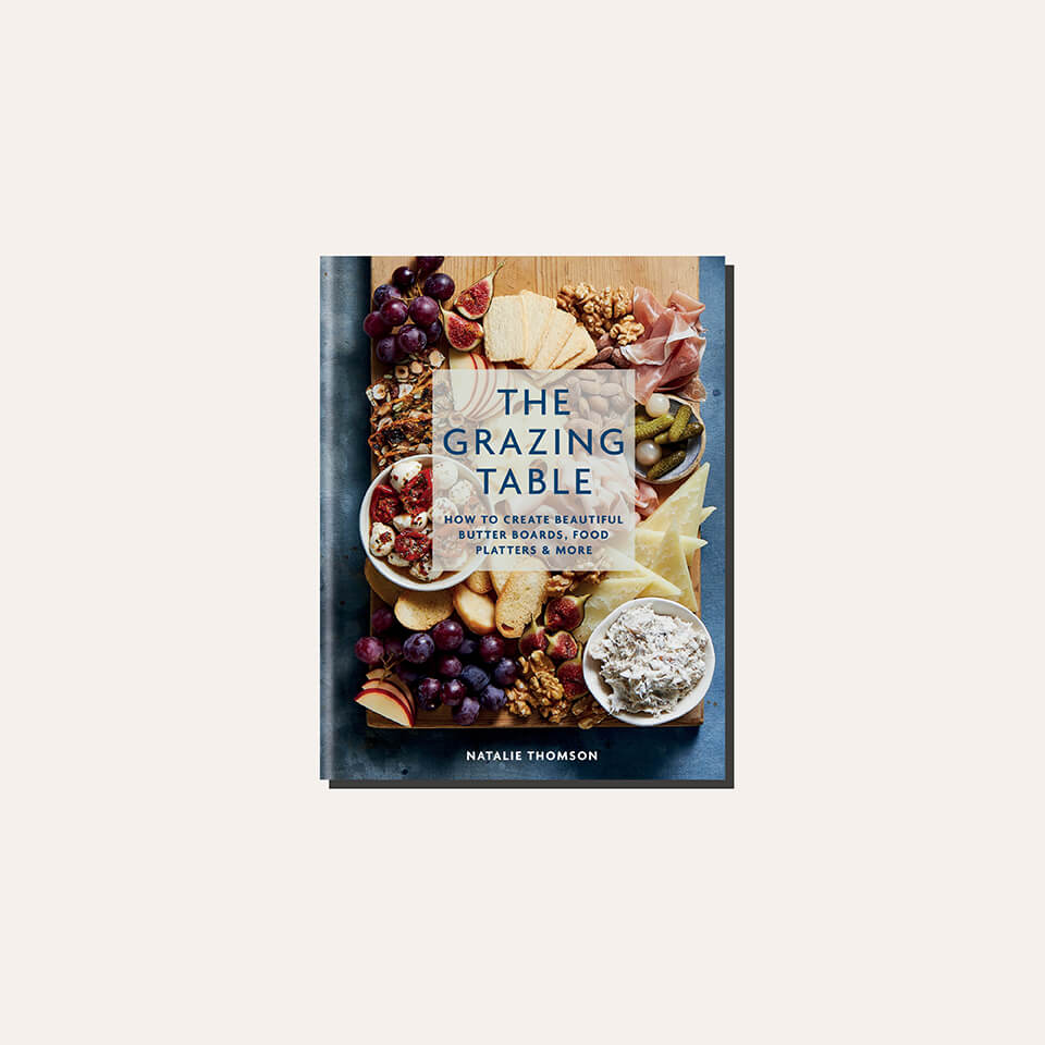 A cookbook cover in a light frame