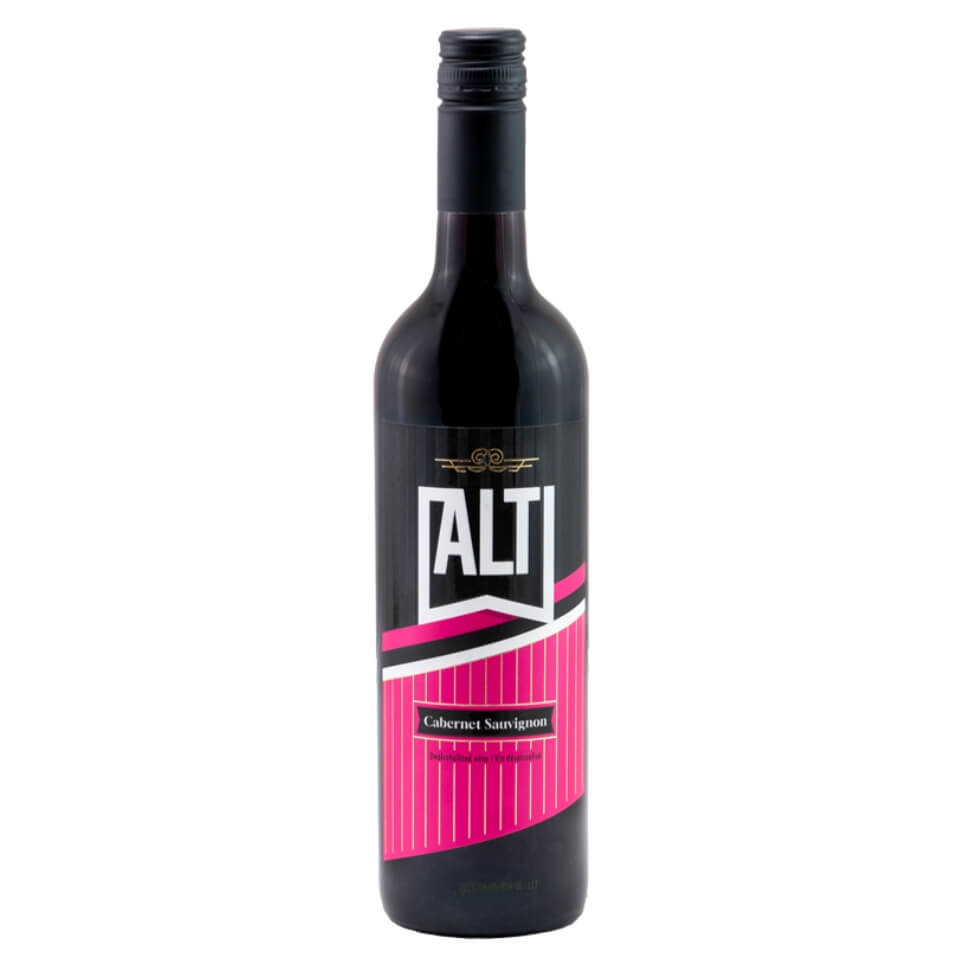 A bottle of red wine with a hot pink, black and white label