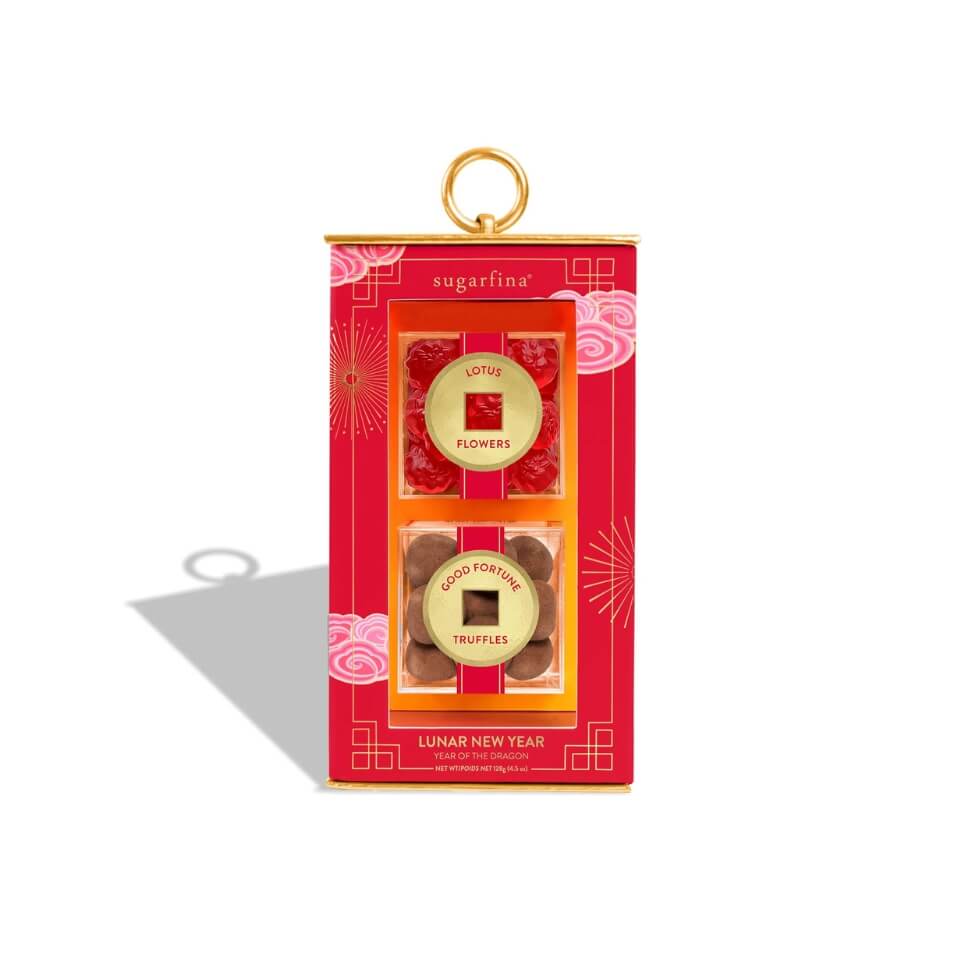 A red lantern-shaped box with two boxes of candy