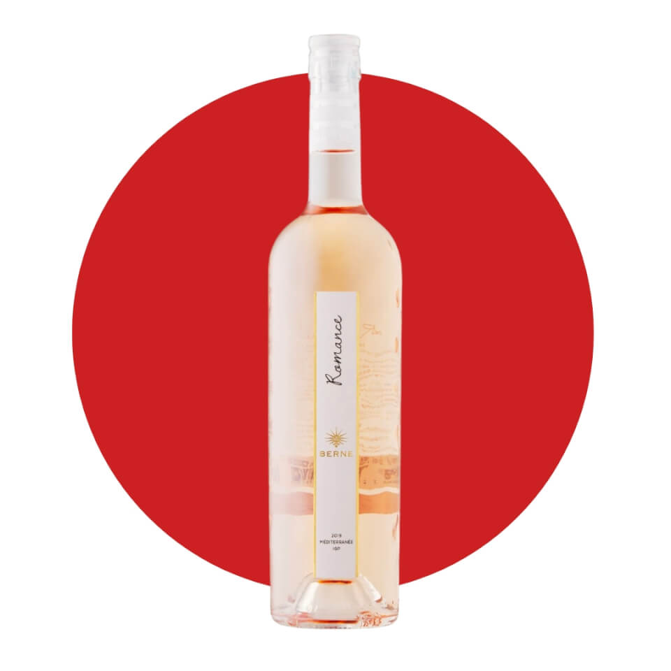 A bottle of pink wine in front of a red circle