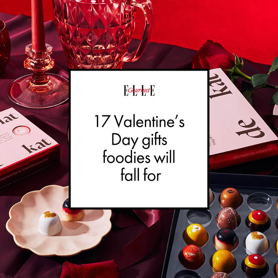 An image of chocolates and red items on a table with a white graphic box overtop