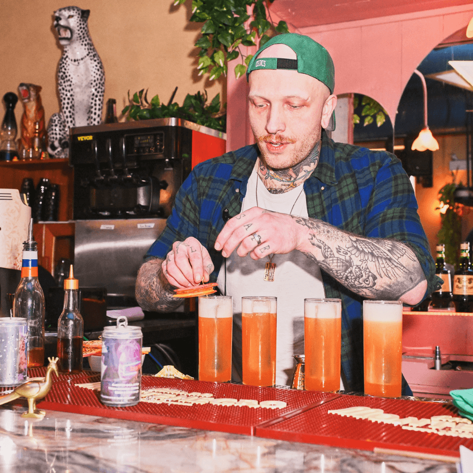 Man making cocktails behind the bar