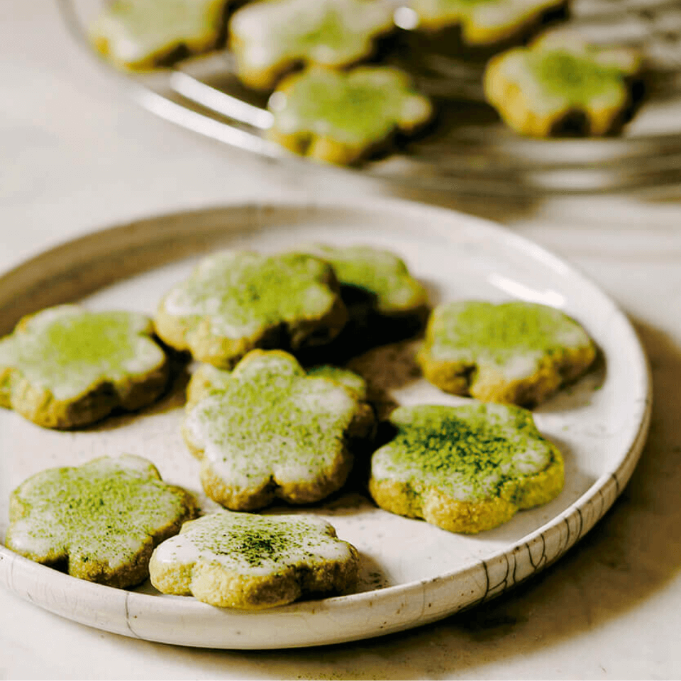 green flower shape cookies on plate