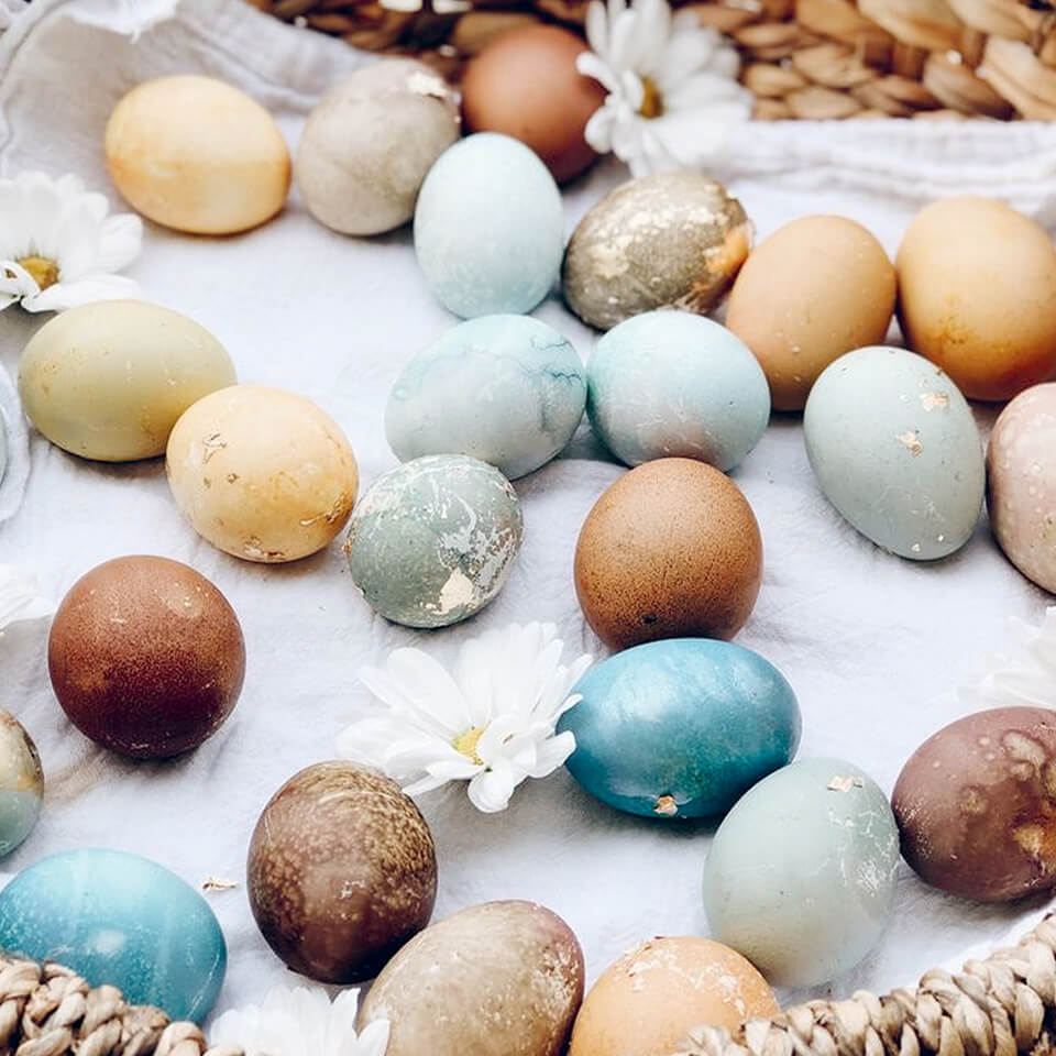 An assortment of Easter eggs dyed naturally basket