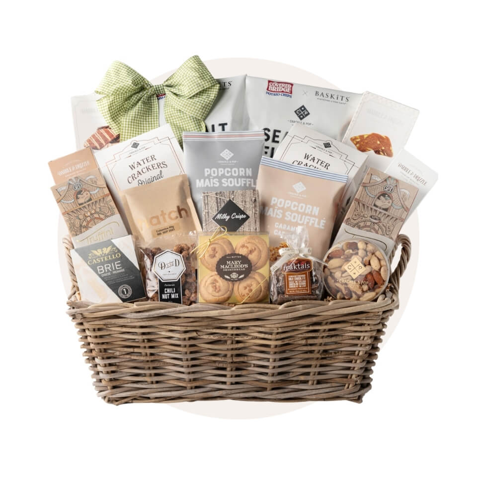 A gift basket filled with edible items over a cream-coloured circle