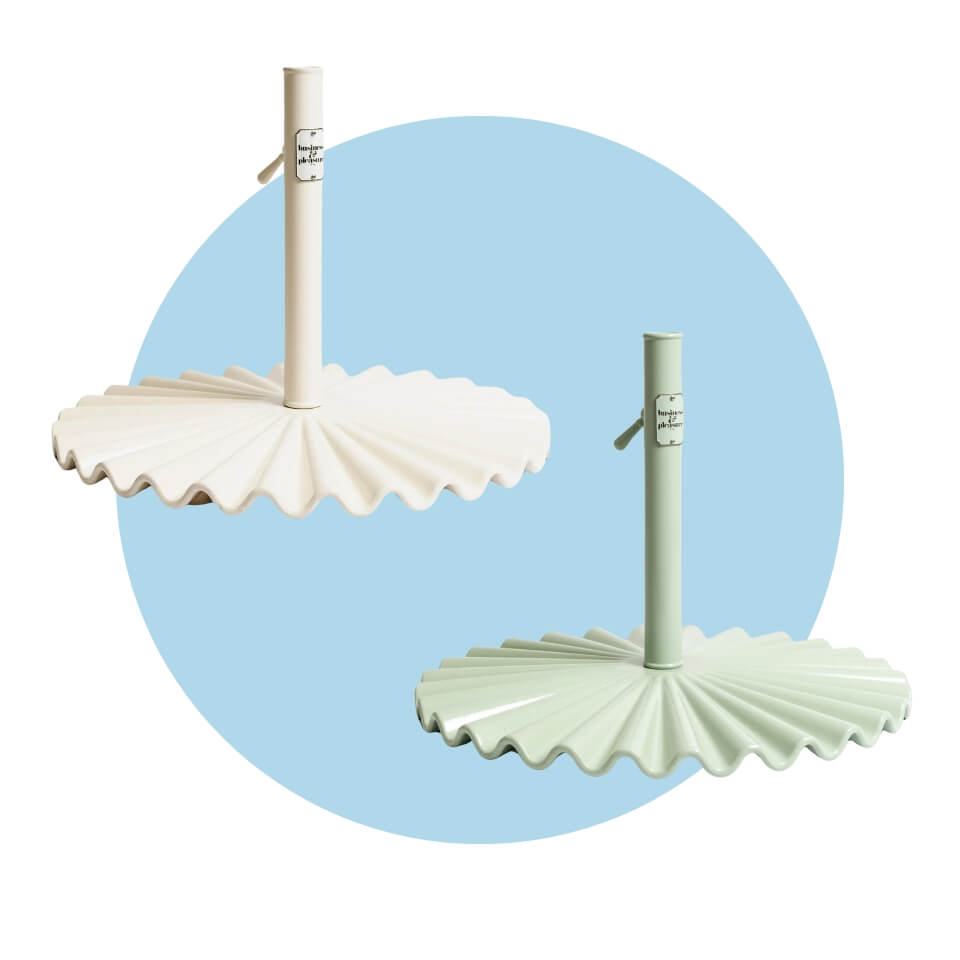 A white and a green umbrella base over a light blue circle