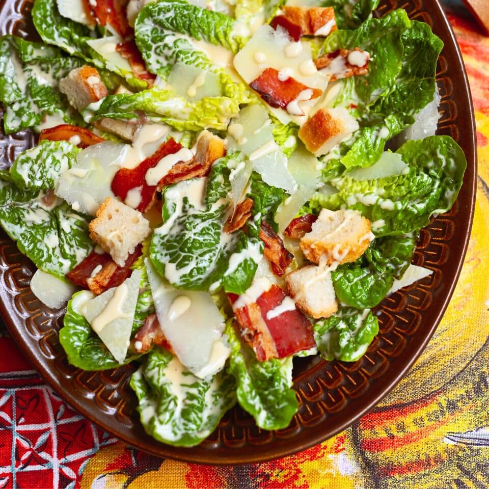 A dish with Caesar salad