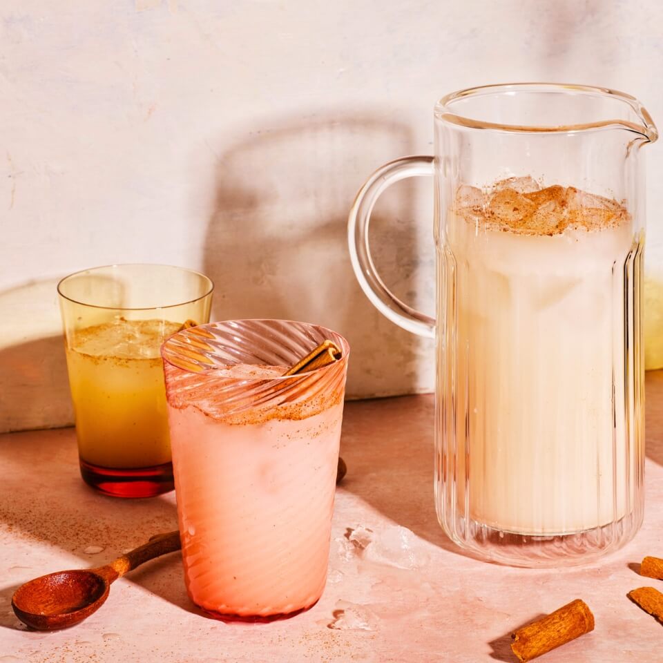 A jug and glasses of horchata