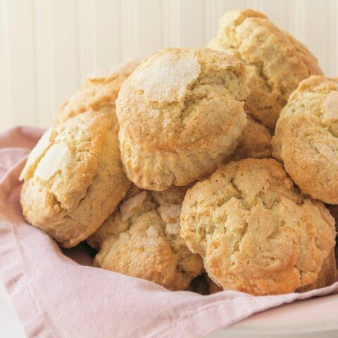 A pile of scones on a pink napkin.