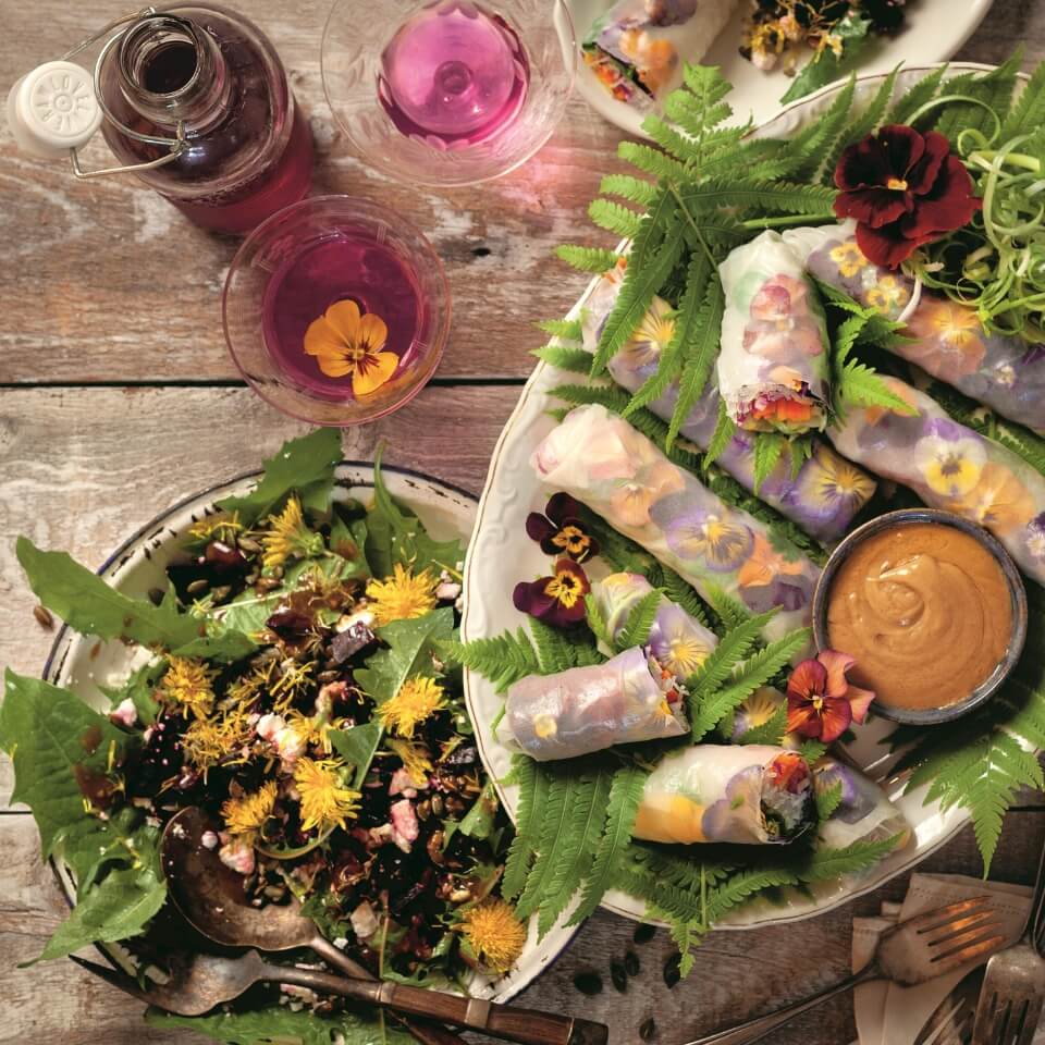 A platter with spring rolls filled with pansies