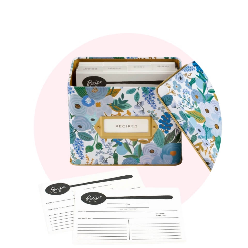 A blue floral box and white recipe cards in a light pink circle