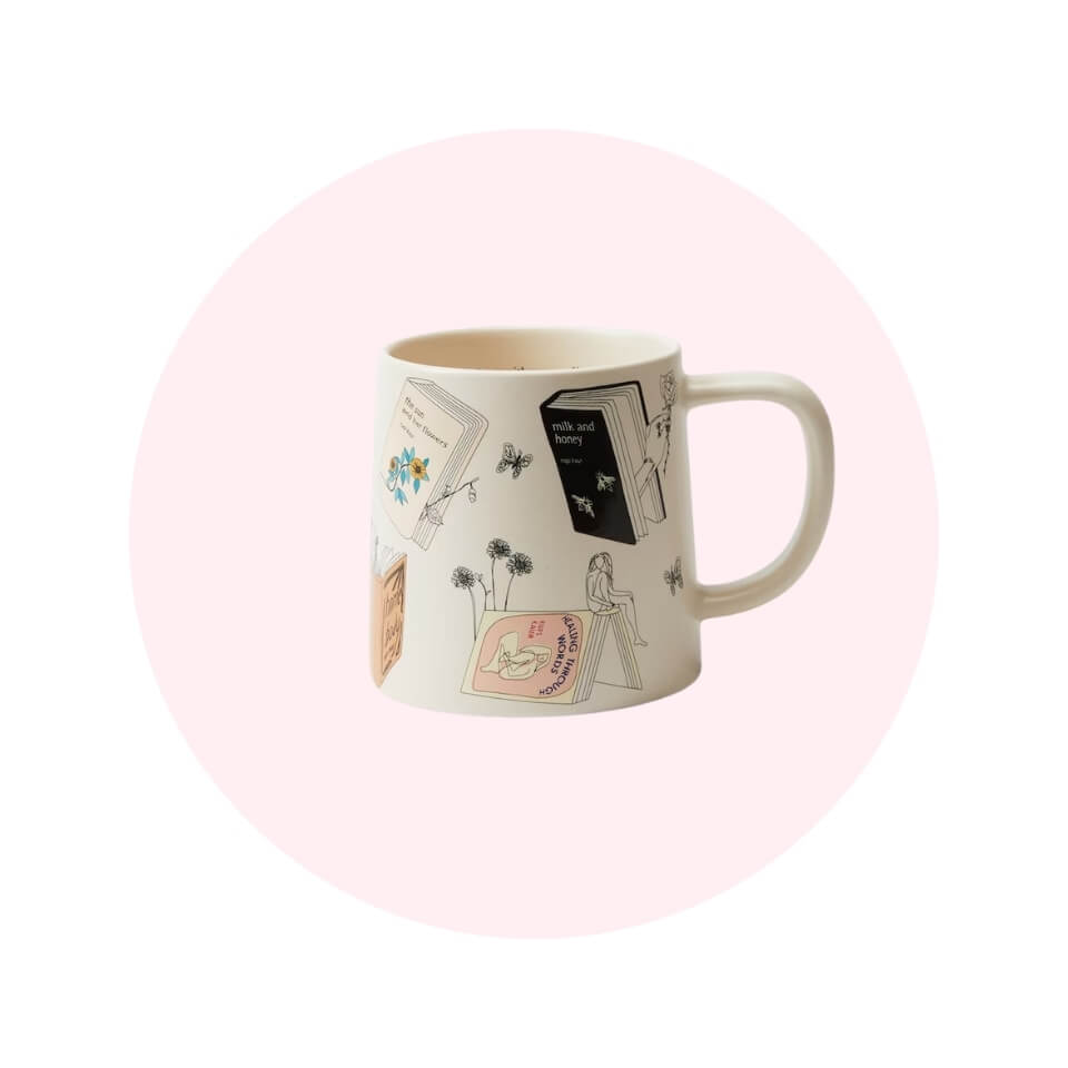 A cream-coloured mug with drawings in a light pink circle