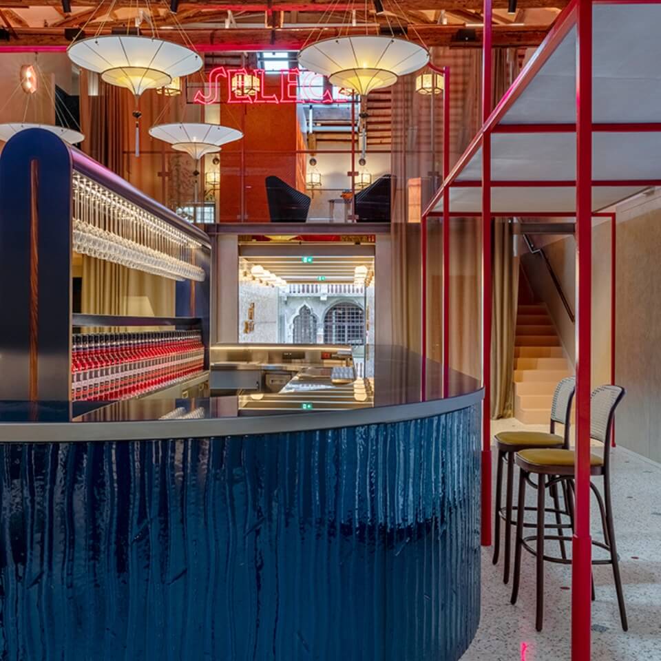 A blue wooden bar with red panelling around it