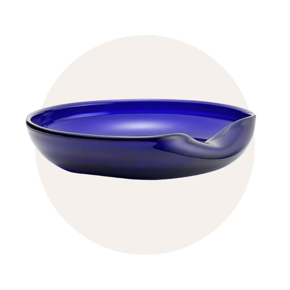 A blue bowl over a light circle