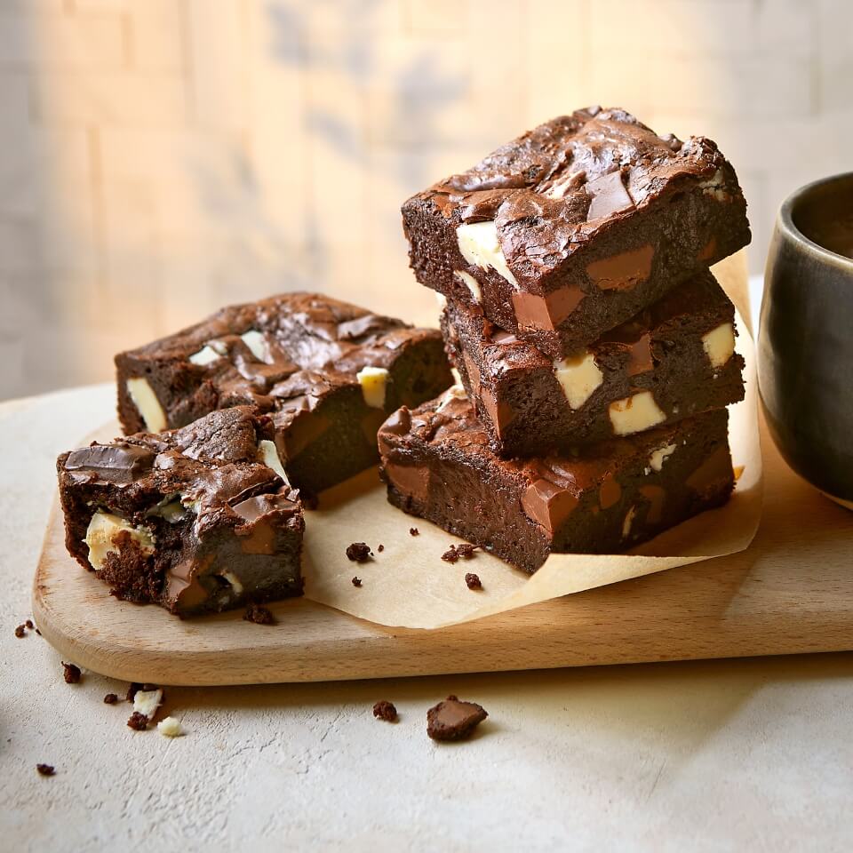 A wooden board with brownies