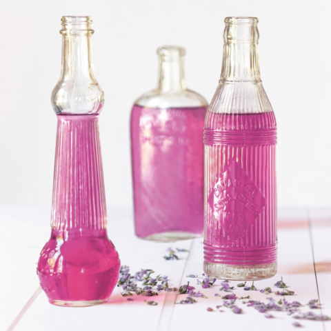Homemade Lavender Simple Syrup in antique bottles