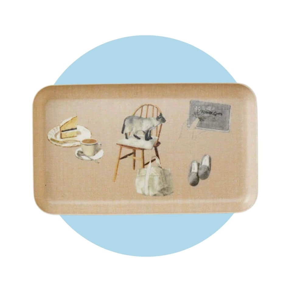 A tray with cats on it over a light blue circle