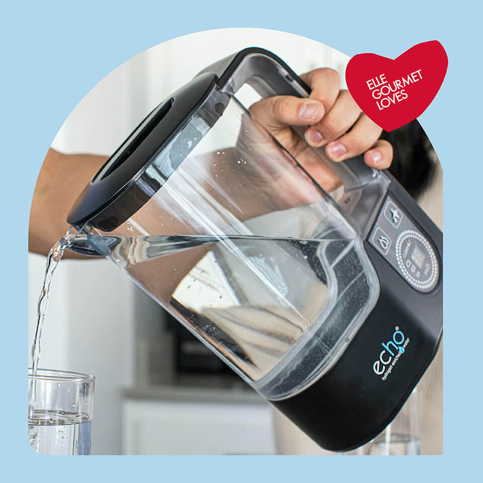 A person pouring water from a pitcher into a glass in a light blue arch frame with a red heart