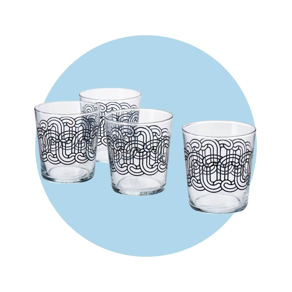 Four glasses with a black pattern over a light blue circle