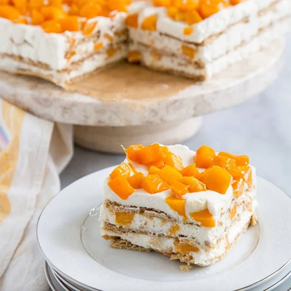This easy mango royale recipe has three layers of whipped cream with small mango chunks on top.