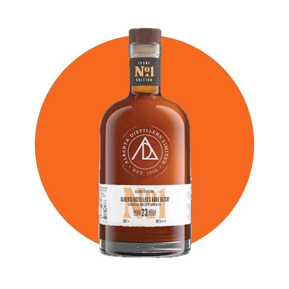 A bottle of whisky over an orange circle