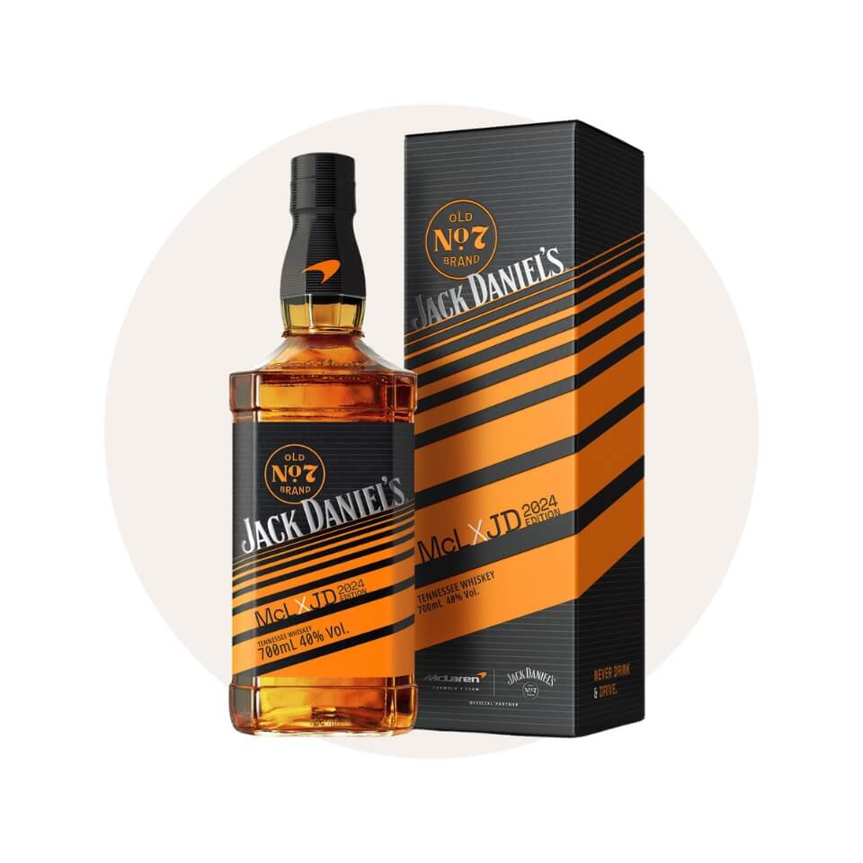 A bottle of whisky and a box over a cream-coloured circle