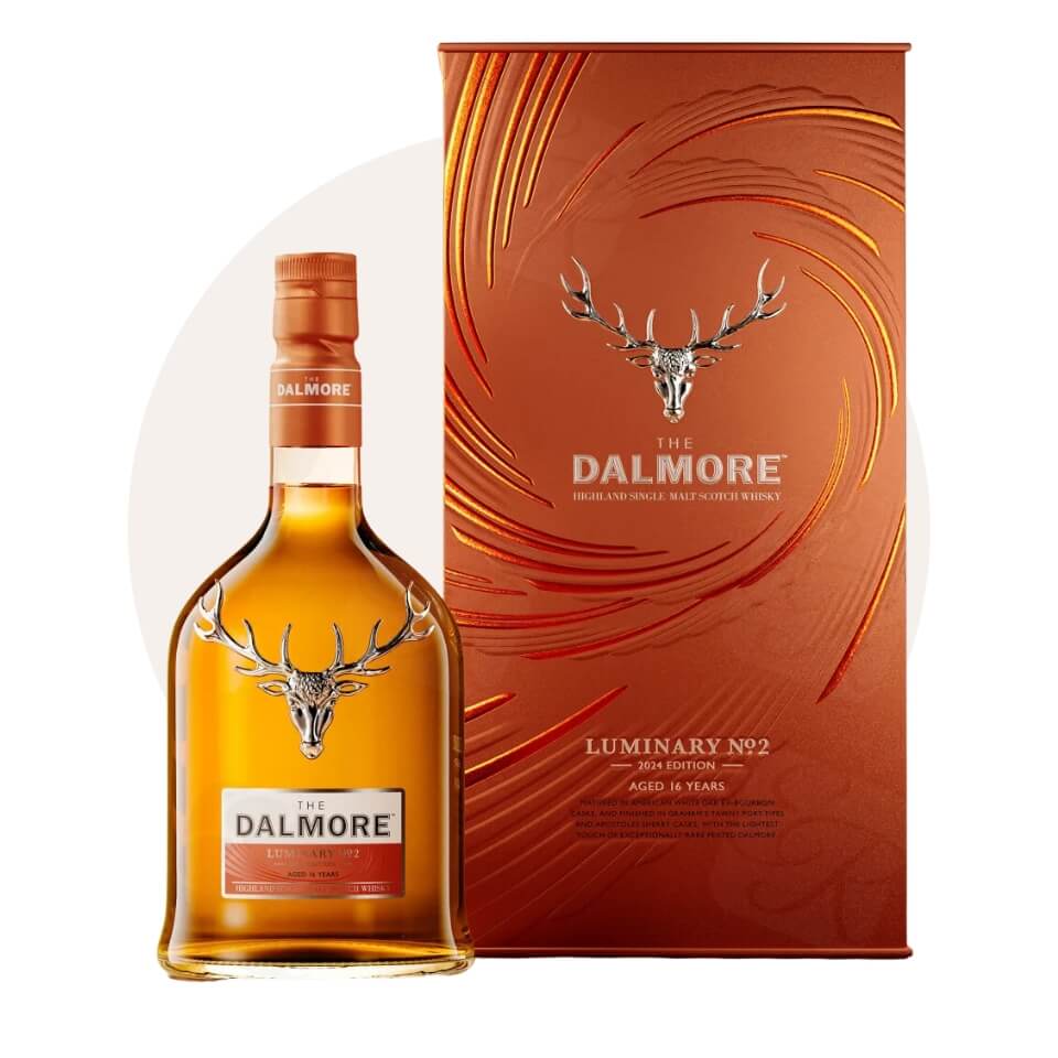 A bottle of whisky and a box over a cream-coloured circle