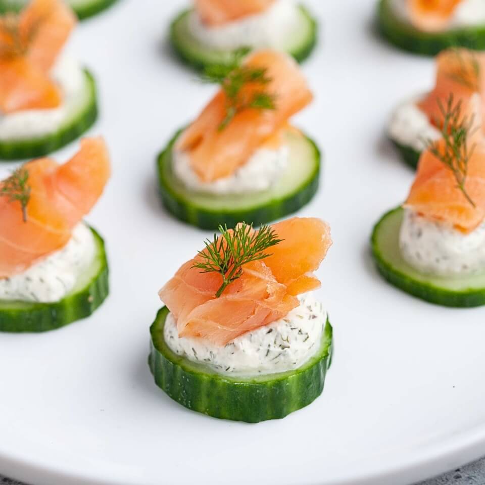Slices of salmon topped with cream cheese and smoked salmon
