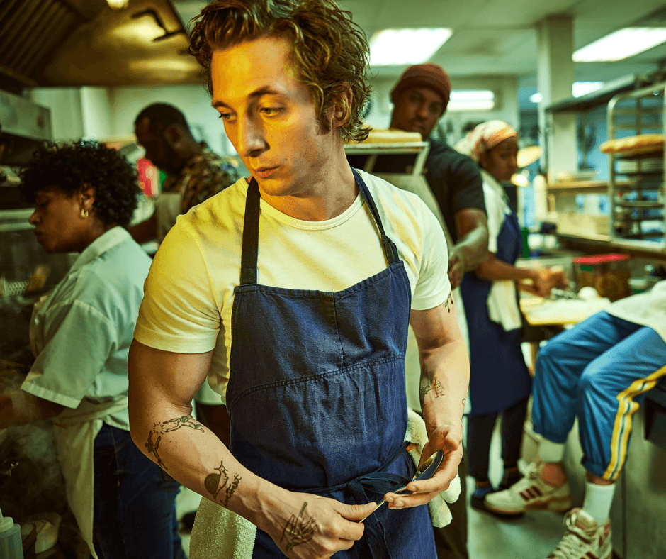 image of man in apron working in restaurant kitchen