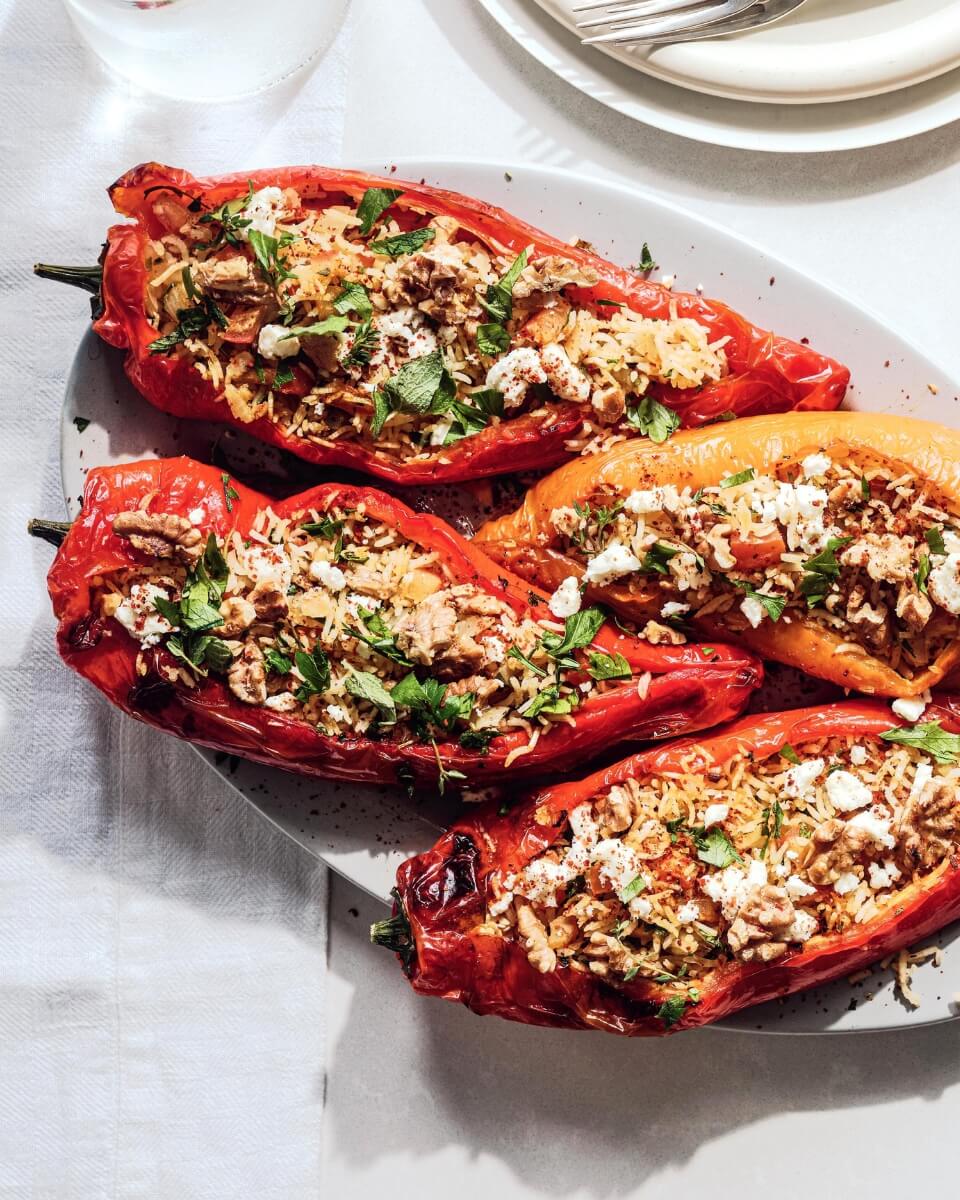 Four stuffed bell peppers on a plate