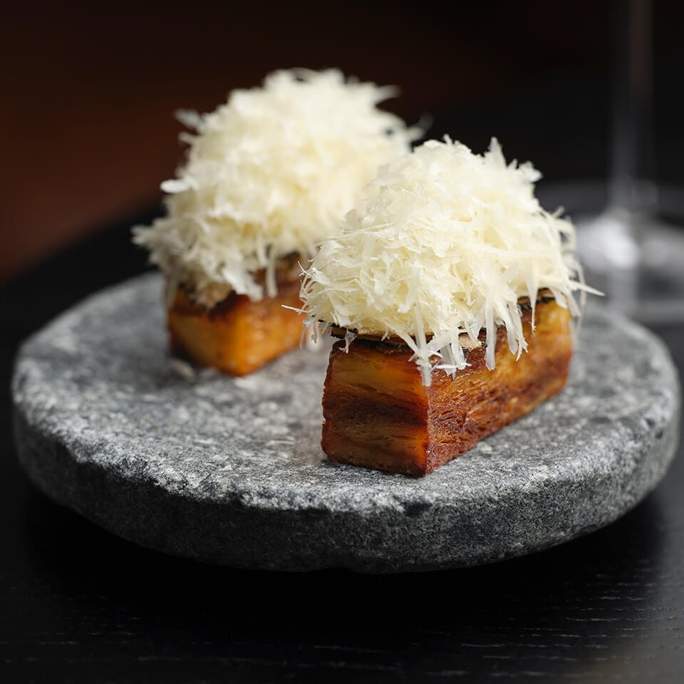 Two desserts on a stone plate