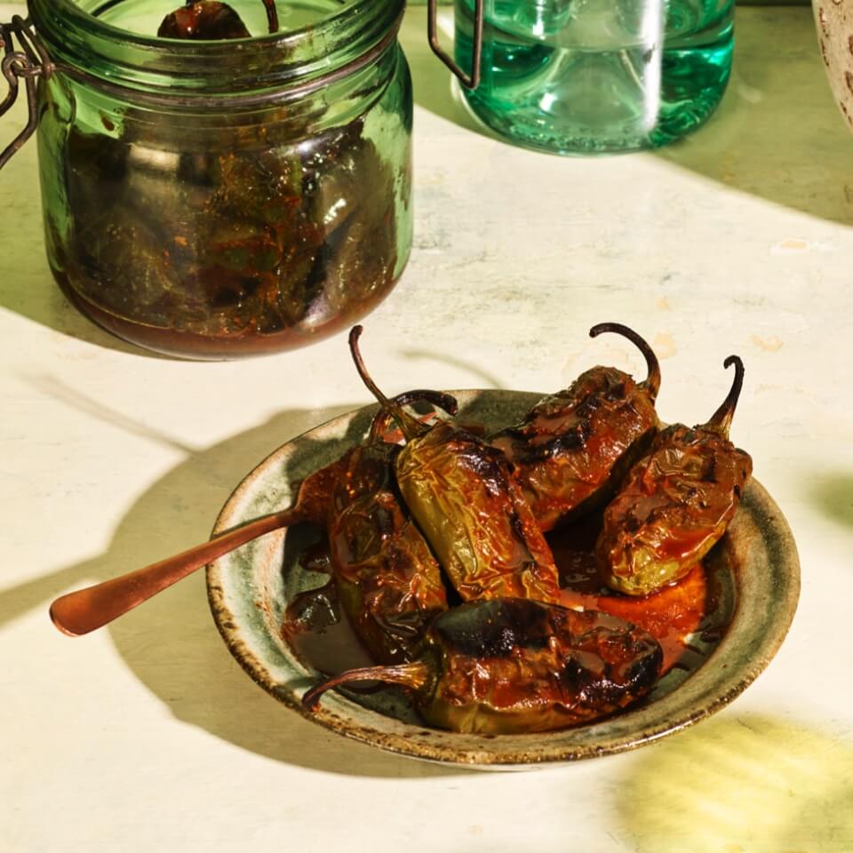 A dish with blistered jalapeno peppers