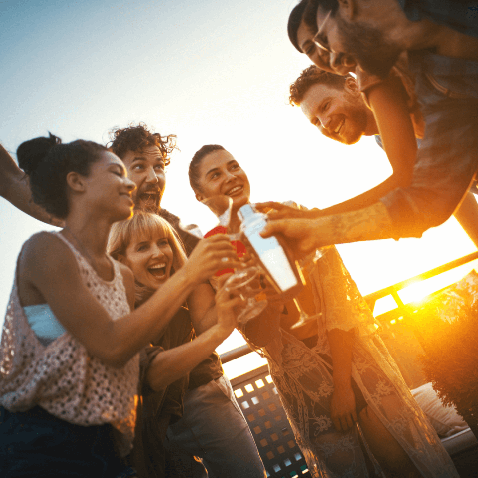 A group of people toasting drinks