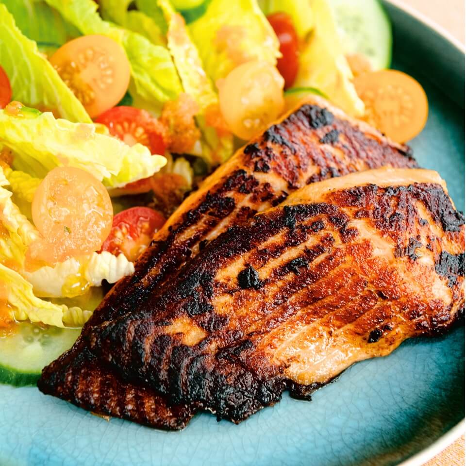 A dish with salmon and salad