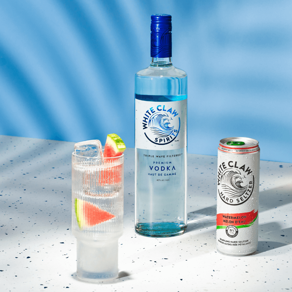 one glass with cocktail, one bottle and one can of spritzer