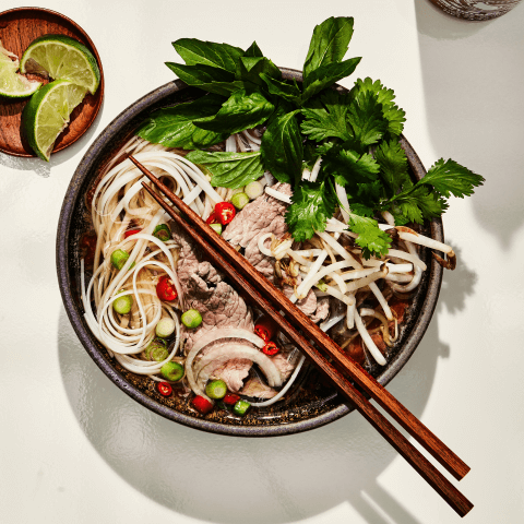 Overhead shot of noodle soup with chopsticks