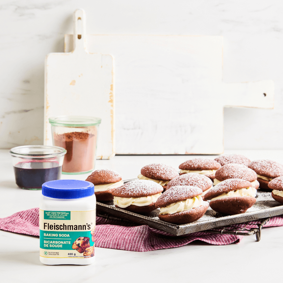 Tray of red velvet Whoopie Pies and Baking Soda container