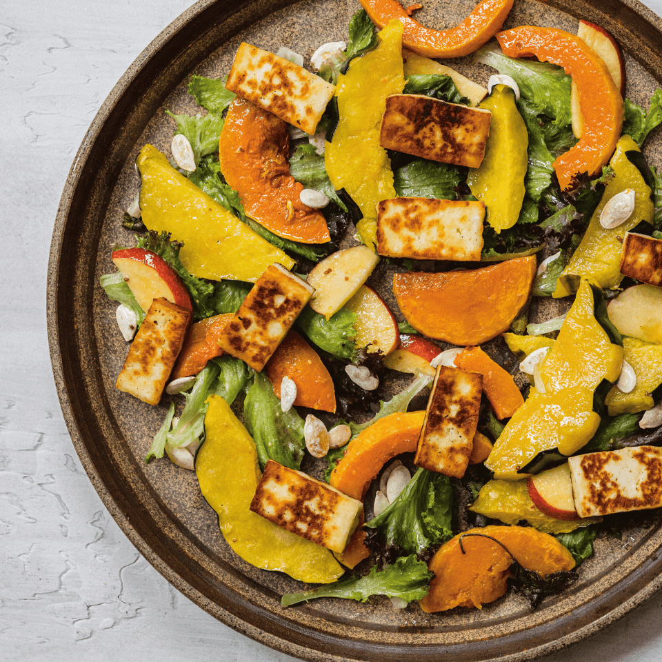 A plate with slices of halloumi and squash.