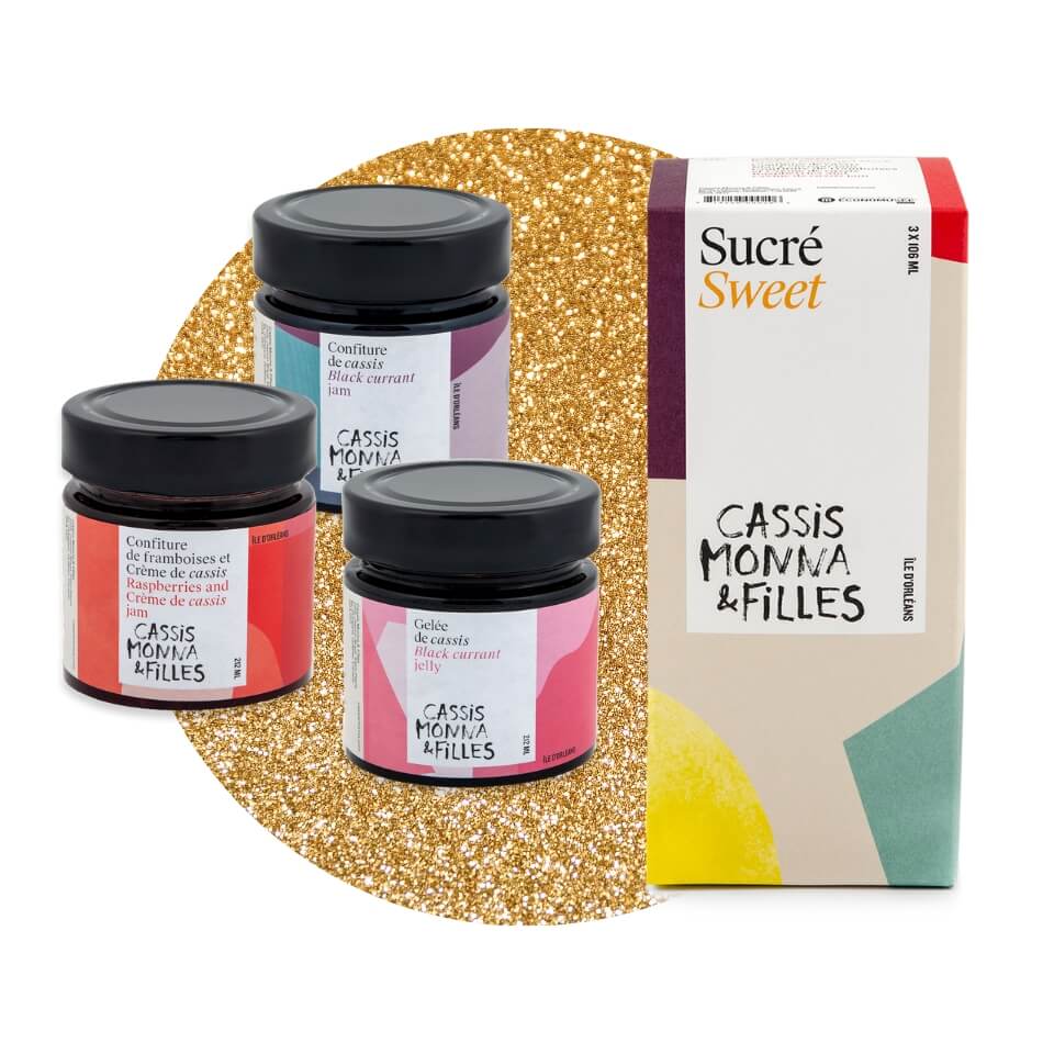 A box and three jars of preserves over a sparkly gold circle