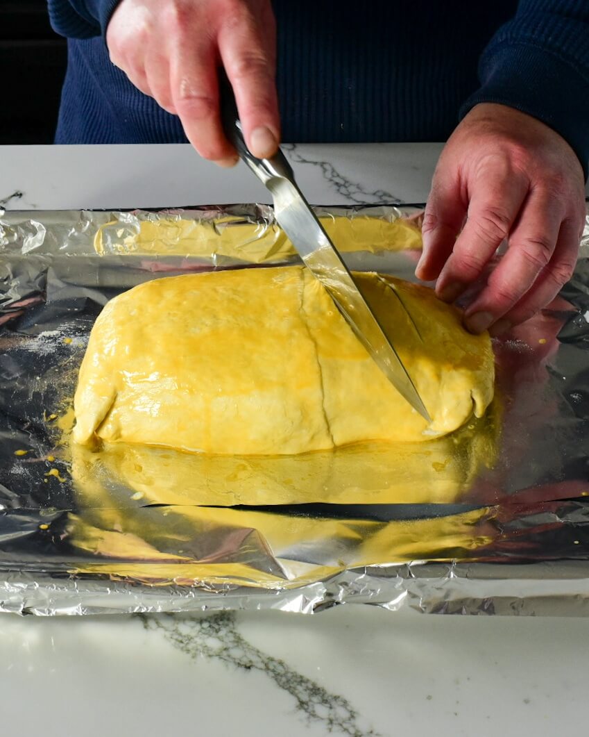 pastry being cut by knife