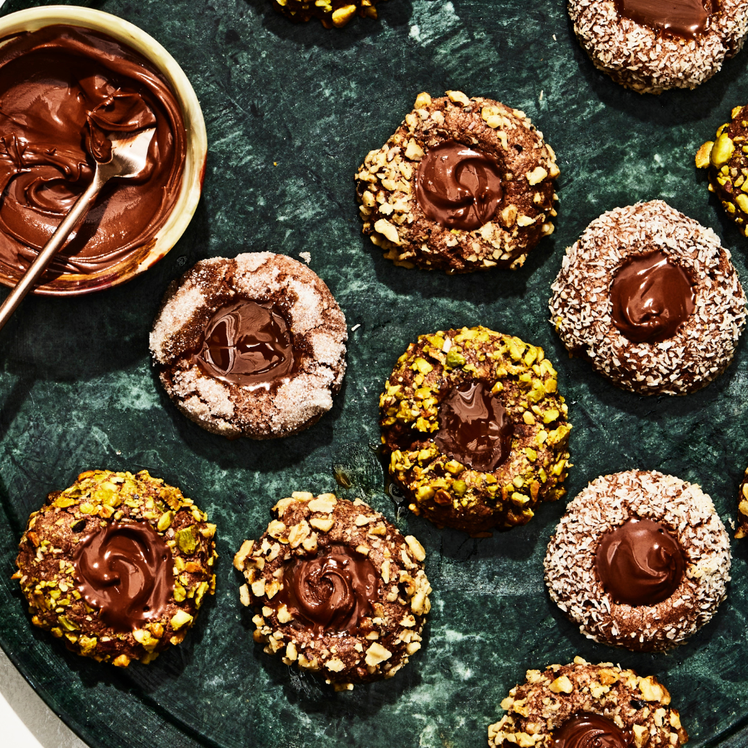 Delicious chocolate thumbprint cookies with chocolate, nutella and dulce de lece filling.