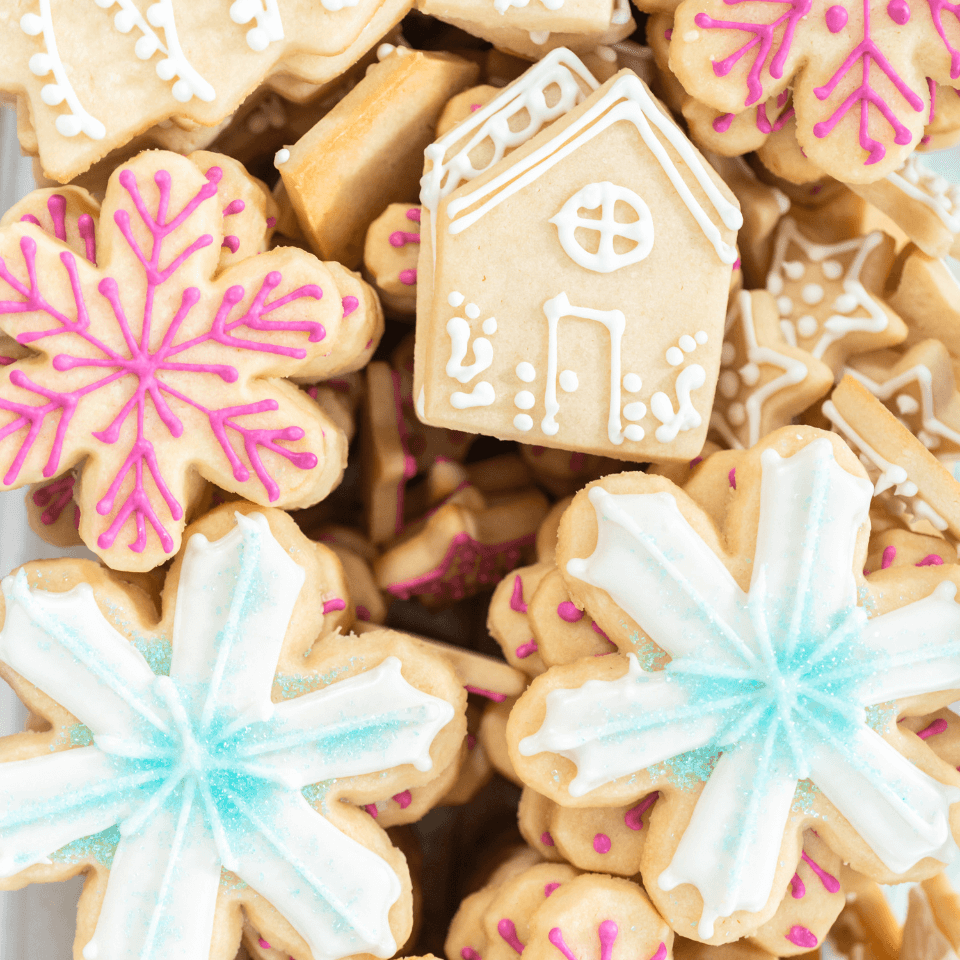 stacks of sugar cookies with piped icing