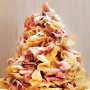 Prosciutto potato chip tower drizzled with hot honey and Parmesan