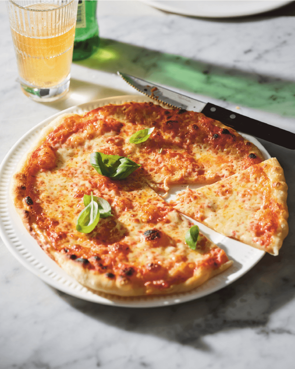 pizza with tomato sauce and cheese